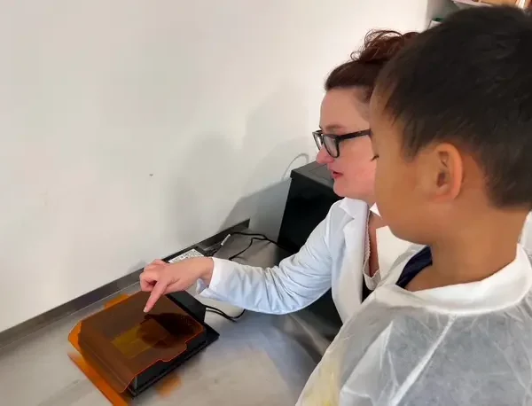 Brandi with kid in lab